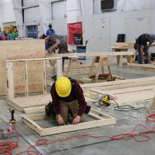 Male student competing in carpentry competition